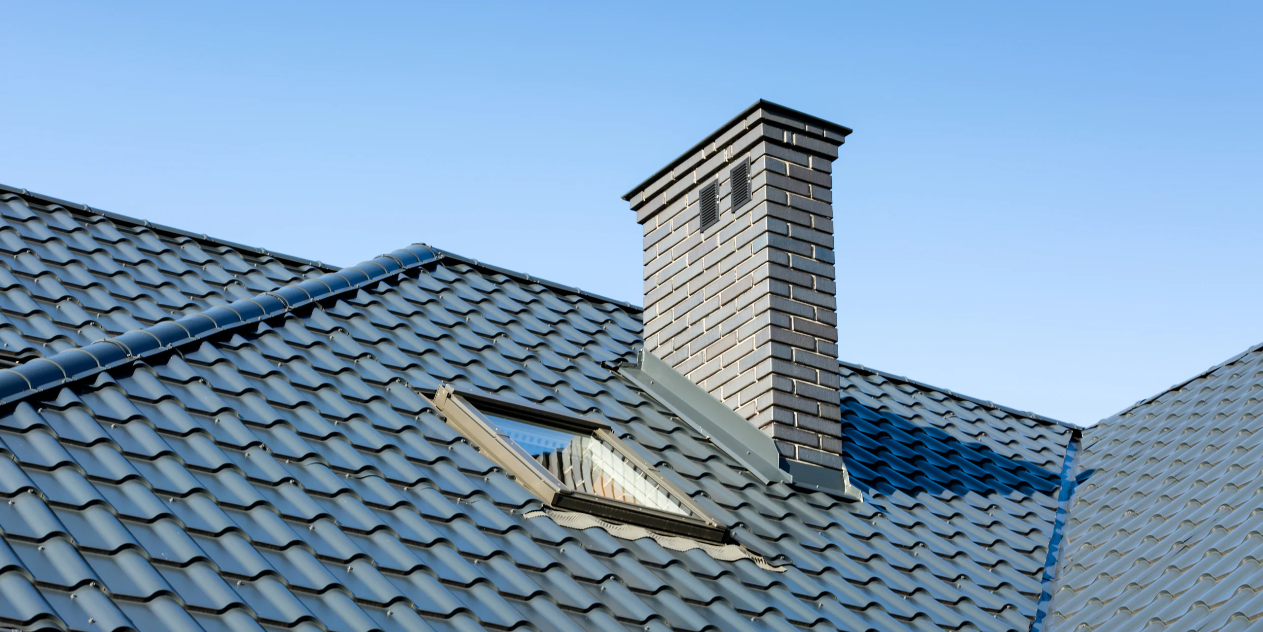 metal roofing and chimney of residential house